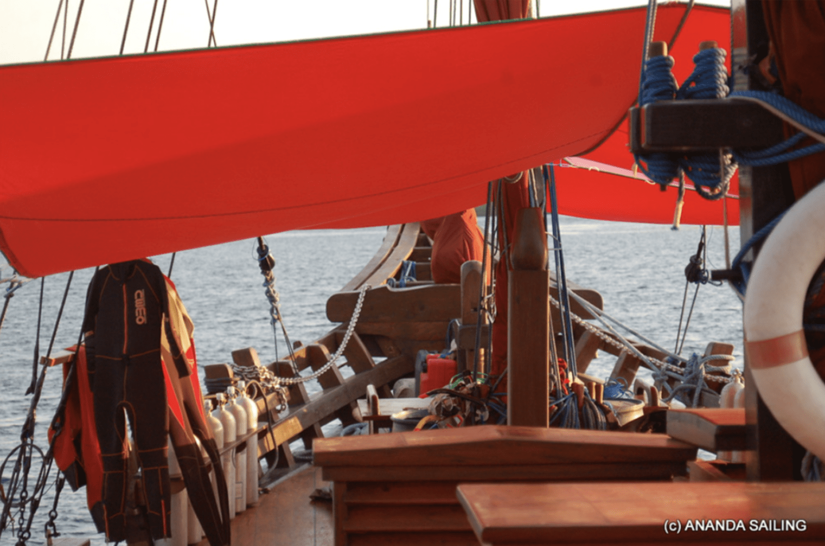 A red sail on a boat with KLM branding is available for sale in Ananda 2019.