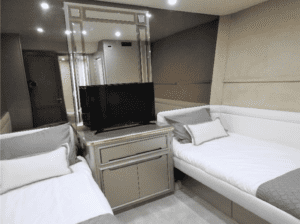 Two Tarrab 112 beds in a room with a tv.