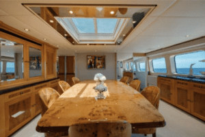 An oceanco 126 yacht featuring a dining room with a skylight.