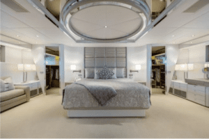 An oceanco 126 luxury yacht with a large bedroom.