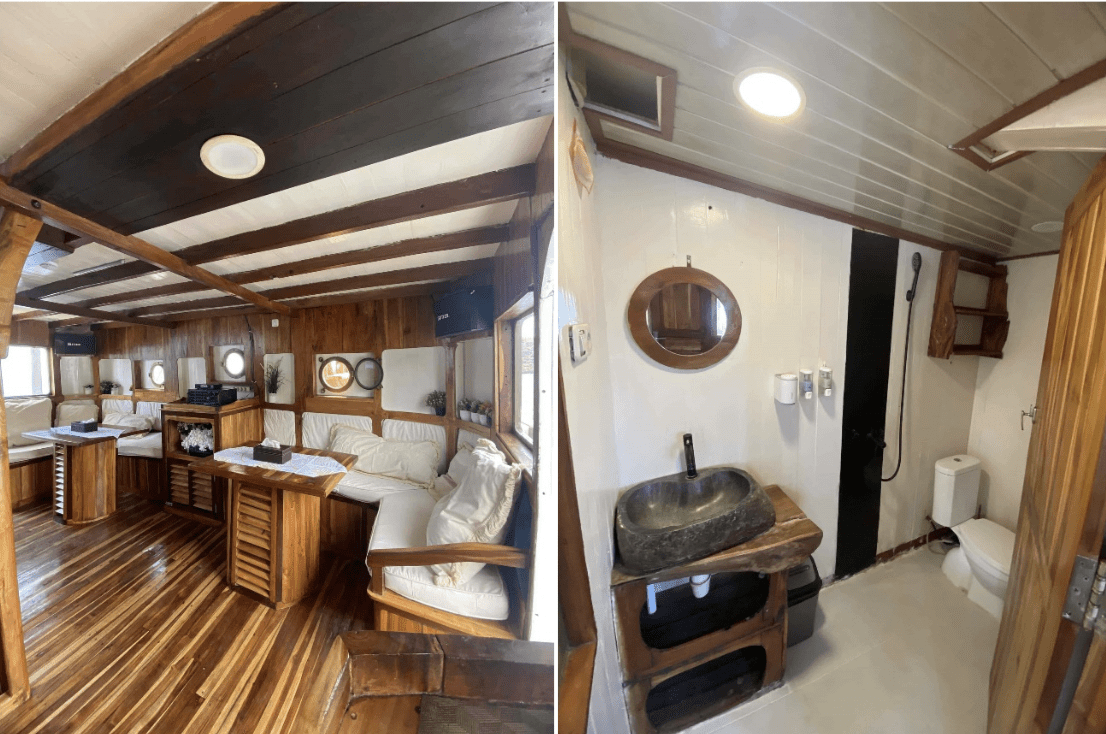 The interior of a wooden boat featuring a toilet and sink.
