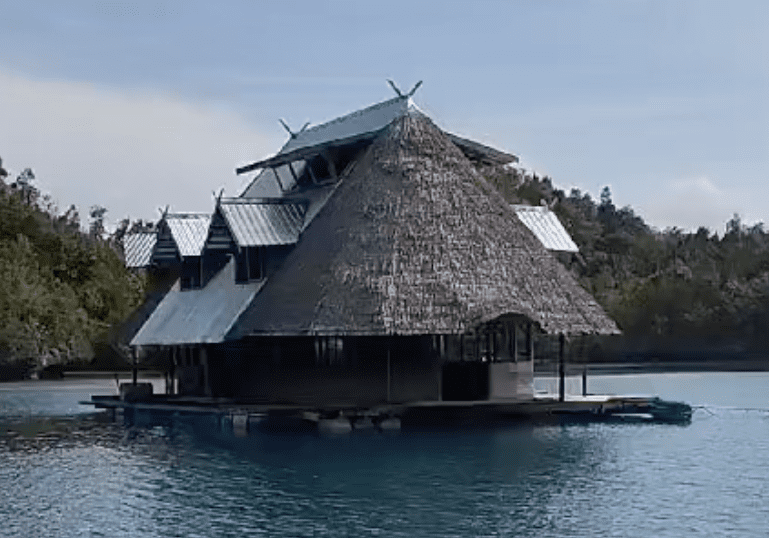 A floating yacht house in the middle of a body of water, offering unique opportunities.